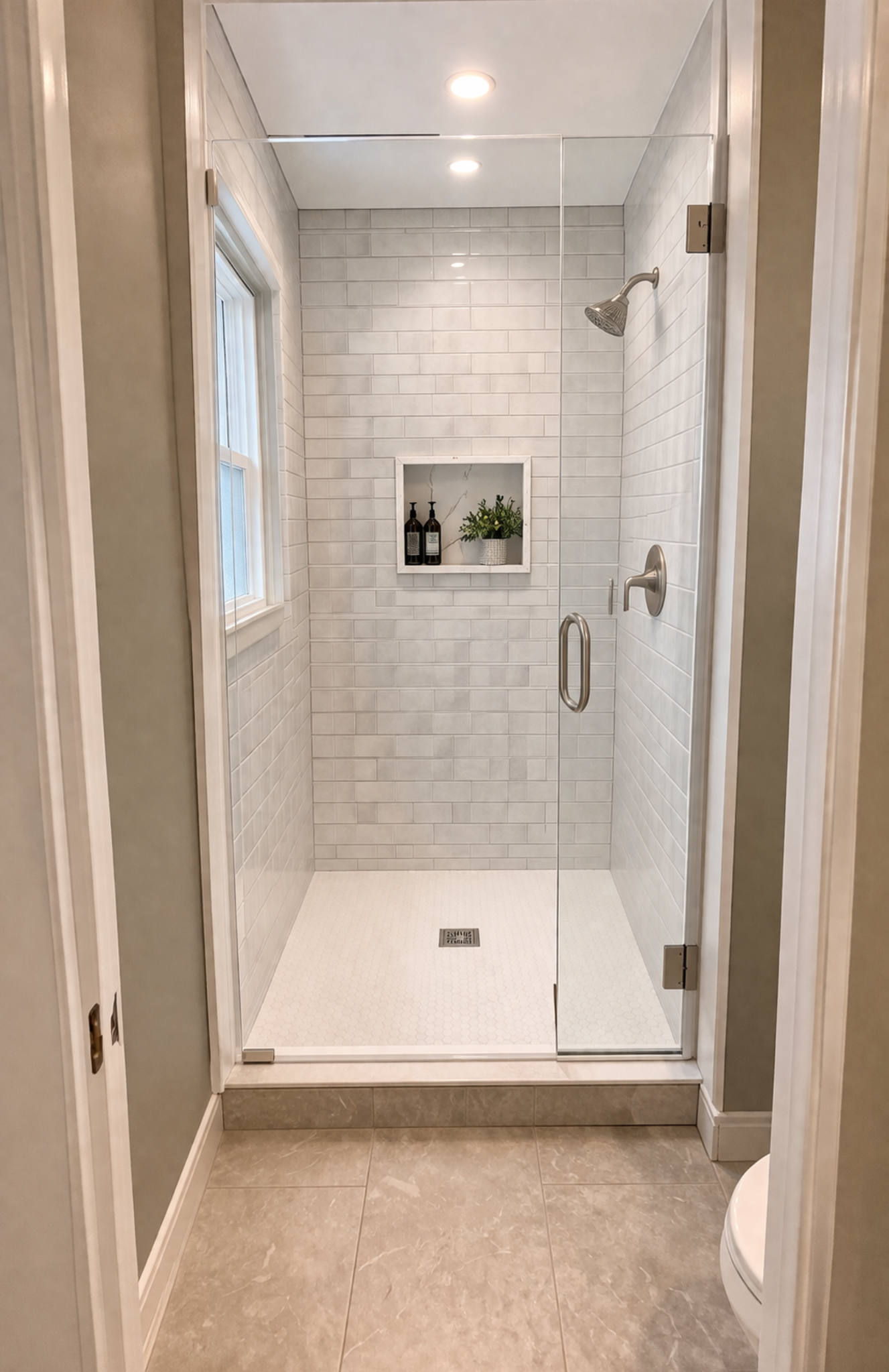 Bathroom after renovation with glass shower